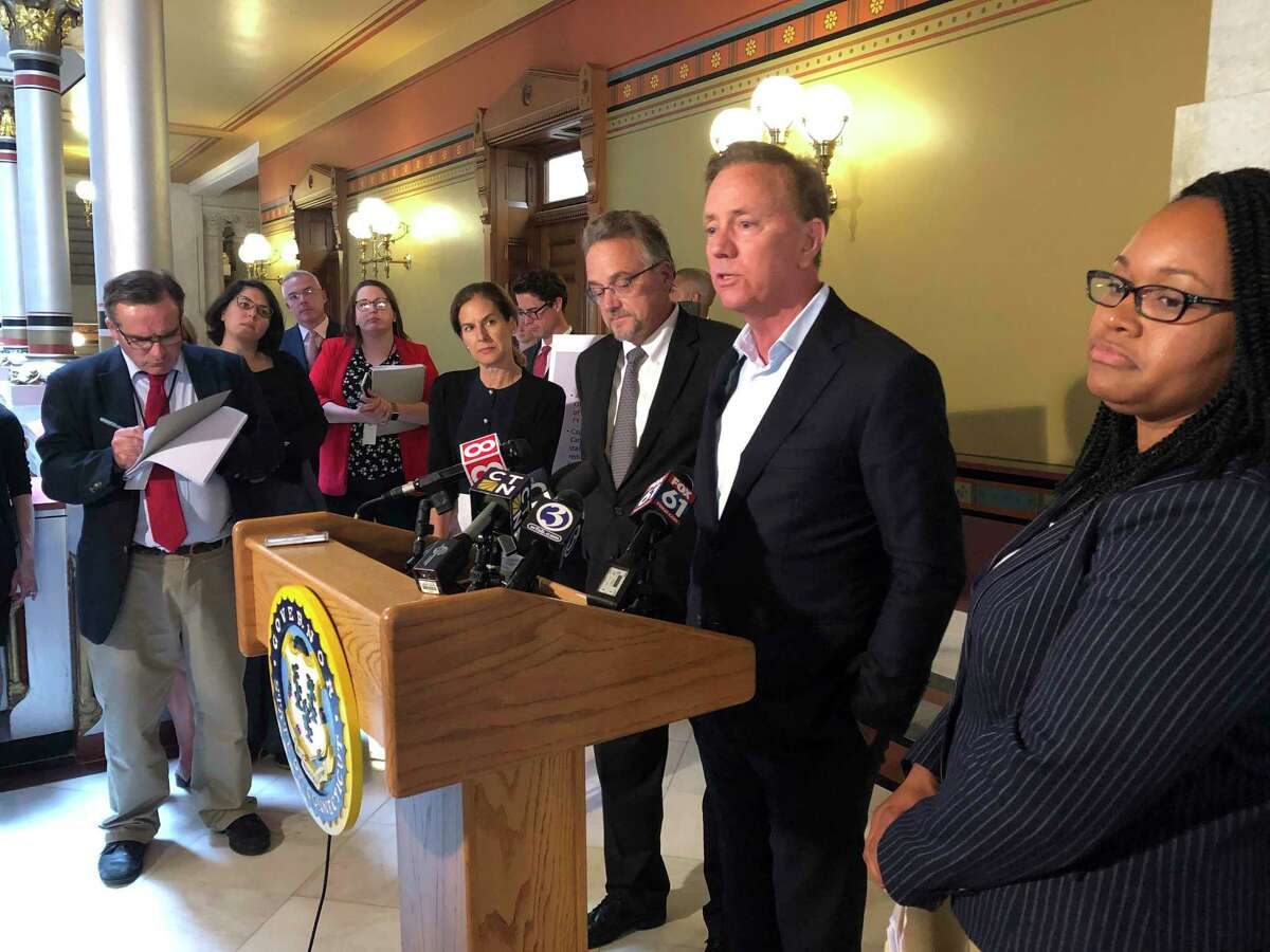 Gov. Ned Lamont, center, in a 2019 file photo.