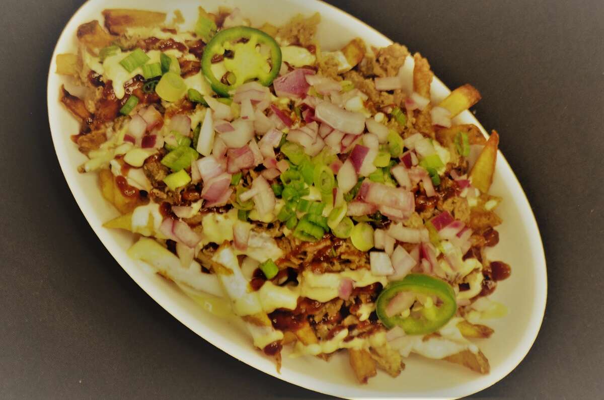 The Cowboy Fry at Minute Maid: fries loaded with queso, chopped brisket, pickled red onions, jalapeño ranch and green onions.
