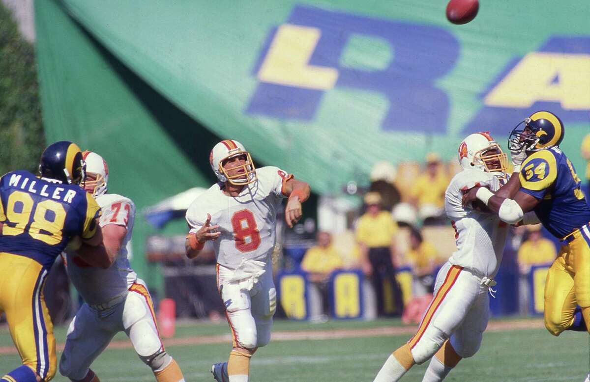 ANAHEIM, CA: Steve Young of the Tampa Bay Buccaneers circa 1986 passes against the Los Angeles Rams at Anaheim Stadium in Anaheim, Califrnia. (Photo by Owen C. Shaw/Getty Images)