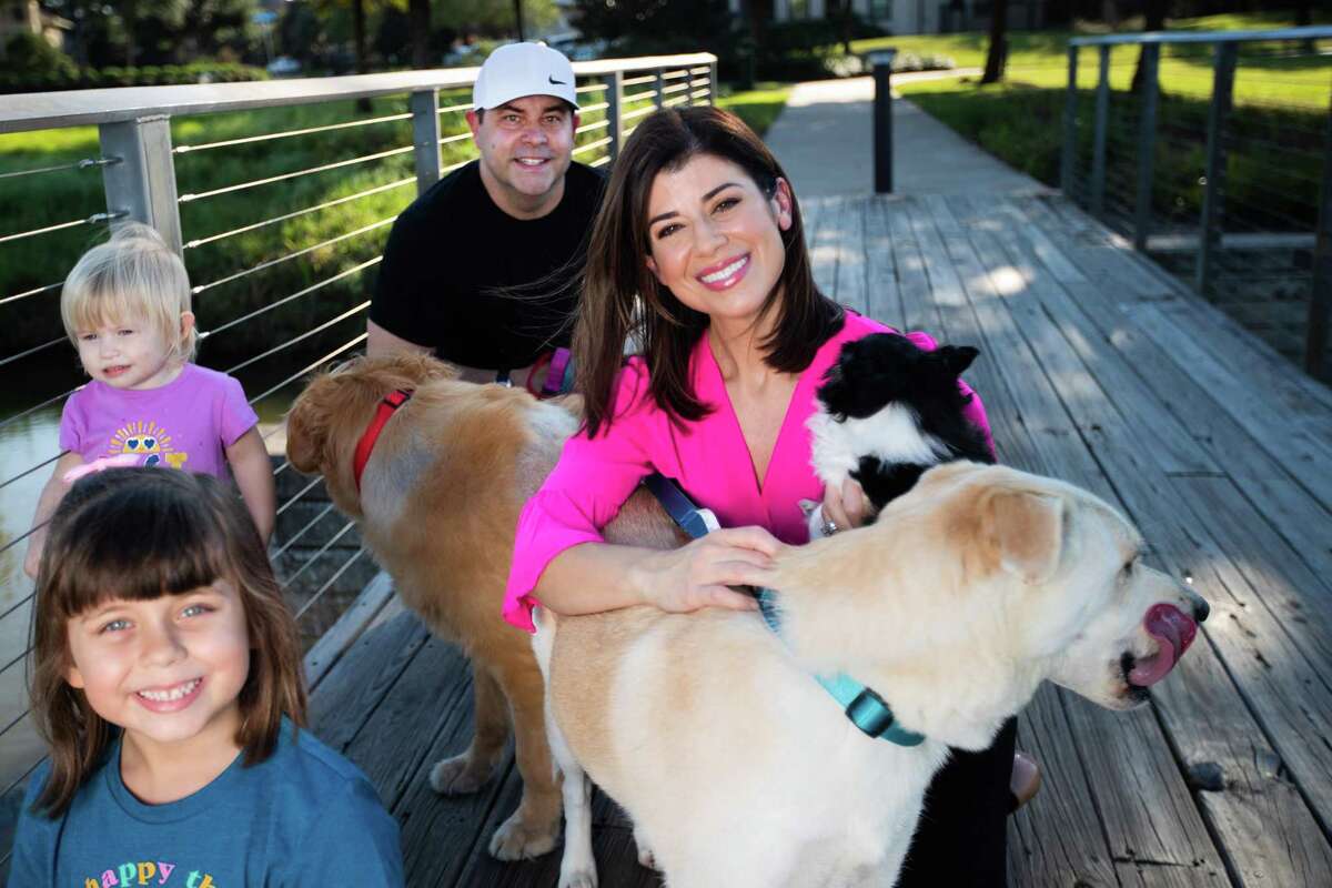 KPRC 2 anchor Lisa Hernandez, her husband Joel Blank, her two daughters Taylor Blank, 6, Maddie Blank, 2, and four rescue dogs, Jack, a Husky-Shepherd mix, Boomer, a Golden Retriever, Sophie, a Pitt-Boxer mix, and Luna, a Chihuahua mix, Wednesday, Oct. 6, 2021, in Sugar Land.