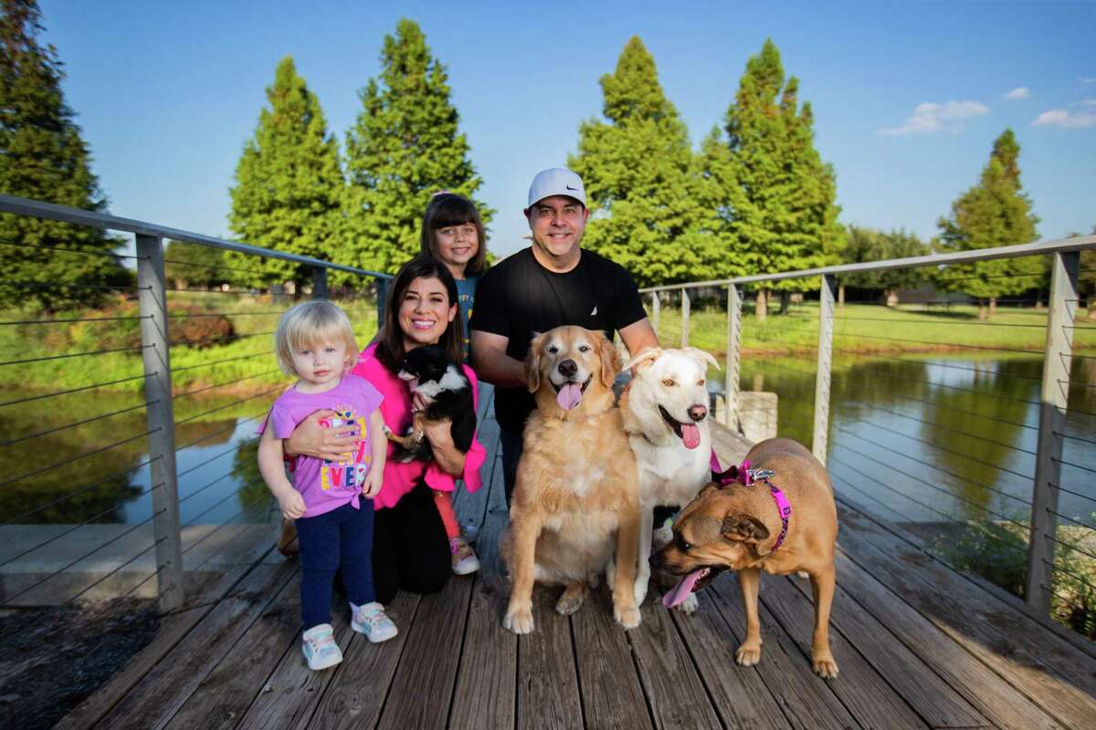 KPRC 2 anchor Lisa Hernandez and her family, including four dogs. 