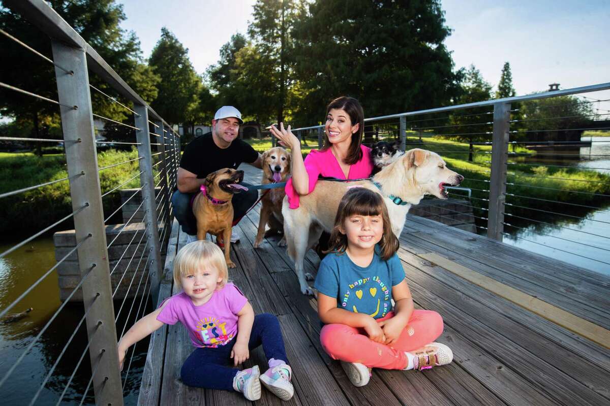 KPRC 2 anchor Lisa Hernandez and her family, including four dogs. 