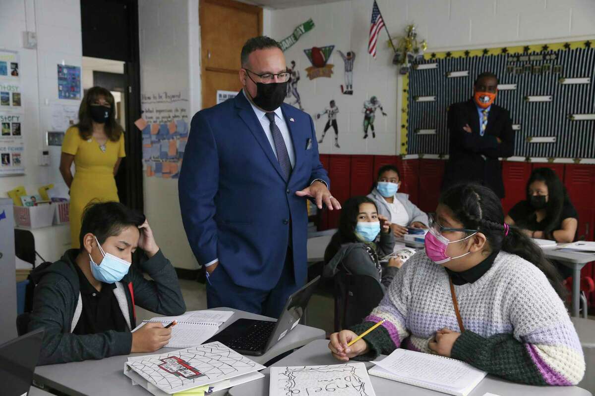 U.S. Secretary of Education Miguel Cardona visits with students in Kimberly Nwosu’s sixth-grade class at Gus Garcia University School in Edgewood ISD, Thursday, Oct. 7, 2021. With Cardona was U.S. Rep. Joaquin Castro. Cardona visited three classrooms and met with a panel of students before holding a press conference. It was his second stop in the two-day Texas visit pushing the administration's Build Back Better campaign.