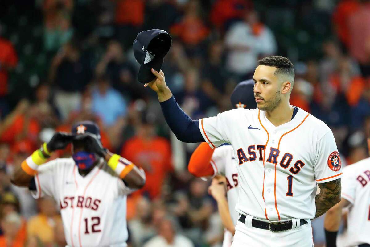 Houston Astros shortstop Carlos Correa (1) acknowledges the crowd before Game 1 of the AL Division Series Thursday, Oct. 7, 2021, in Houston.