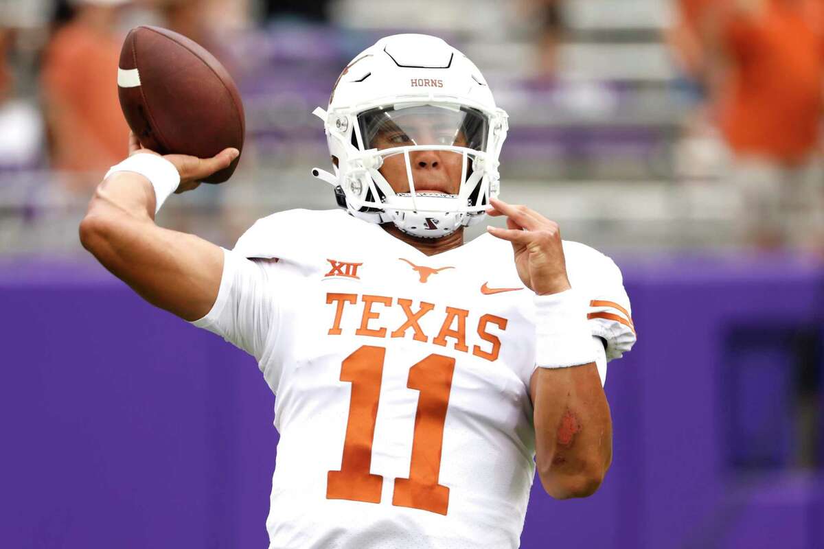 Texas quarterback Casey Thompson (11) warms up before playing TCU in an NCAA college football game Saturday, Oct. 2, 2021, in Fort Worth, Texas. (AP Photo/Ron Jenkins)