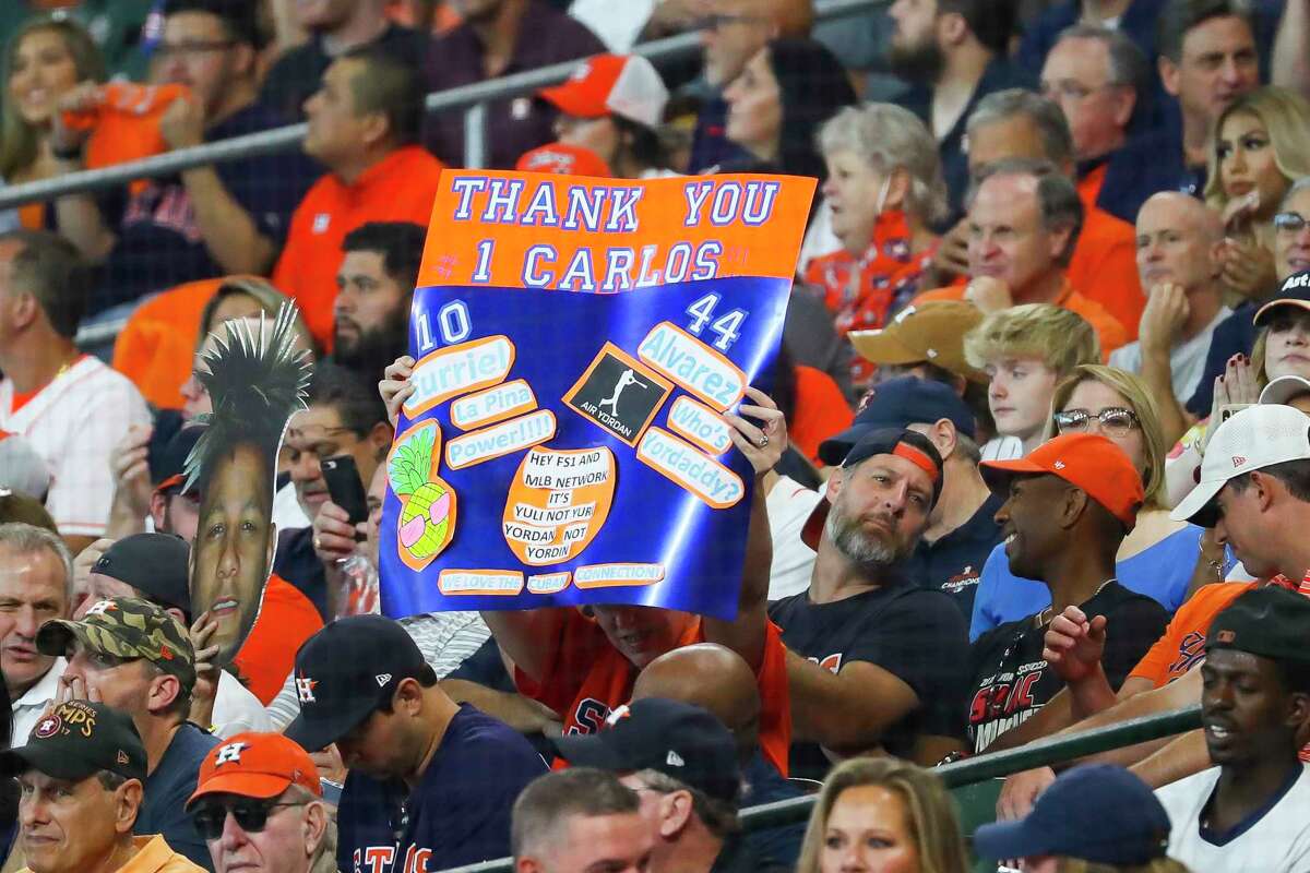 Fans hold a sign for Houston Astros shortstop Carlos Correa (1) during the second inning in Game 1 of the AL Division Series Thursday, Oct. 7, 2021, in Houston.