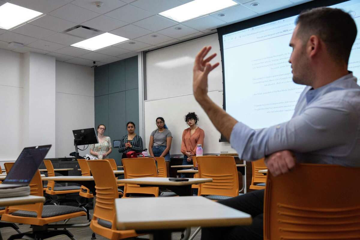 Rice University lecturer Dr. Craig Considine directs a question to his students after presenting their research on Hindu and Muslim relations for his class on Nov. 26, 2019.