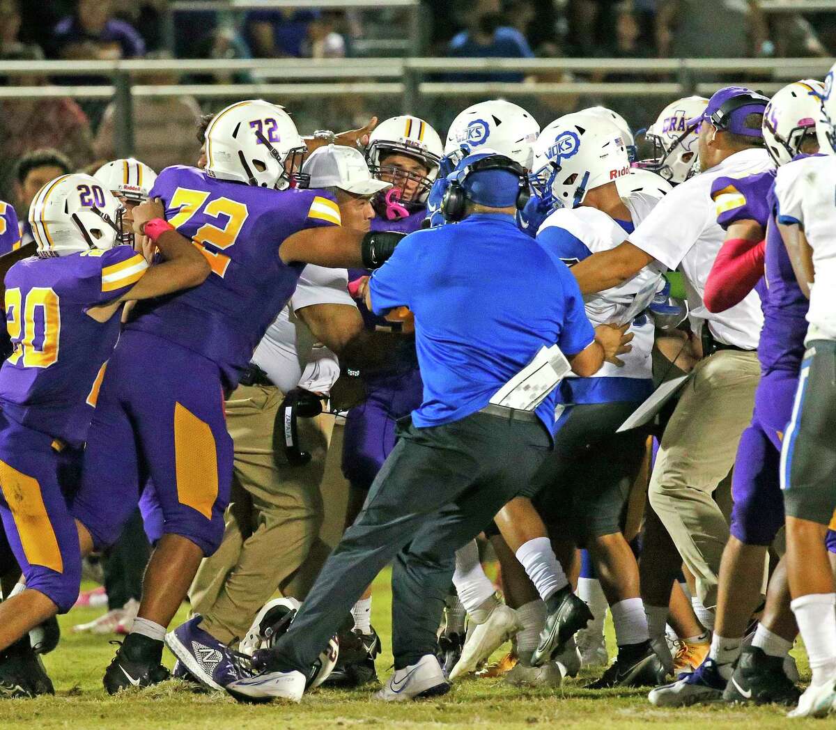 Coaches try to separate the teams after tempers got out of control in the fourth quarter. Lanier defeated Brackenridge 21-14 at SAISD Complex on Friday, September 17, 2021.
