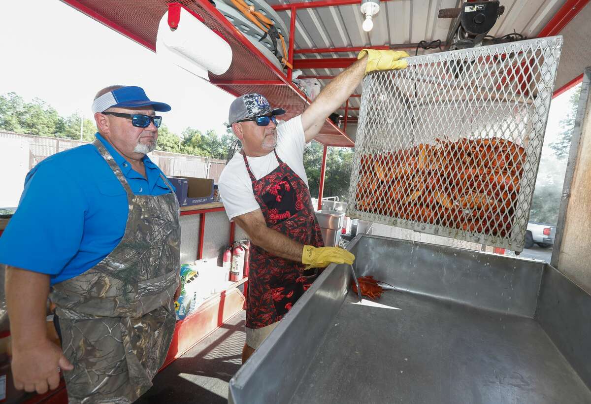 prepare steaks and lobsters for the Conroe/Lake Conroe Chamber of Commerce?•s annual Lobsterfest at the Lone Star Convention Center, Thursday, Oct. 7, 2021, in Conroe. Hundreds of people attended the surf n turf dinner, which is fundraiser for the chamber.