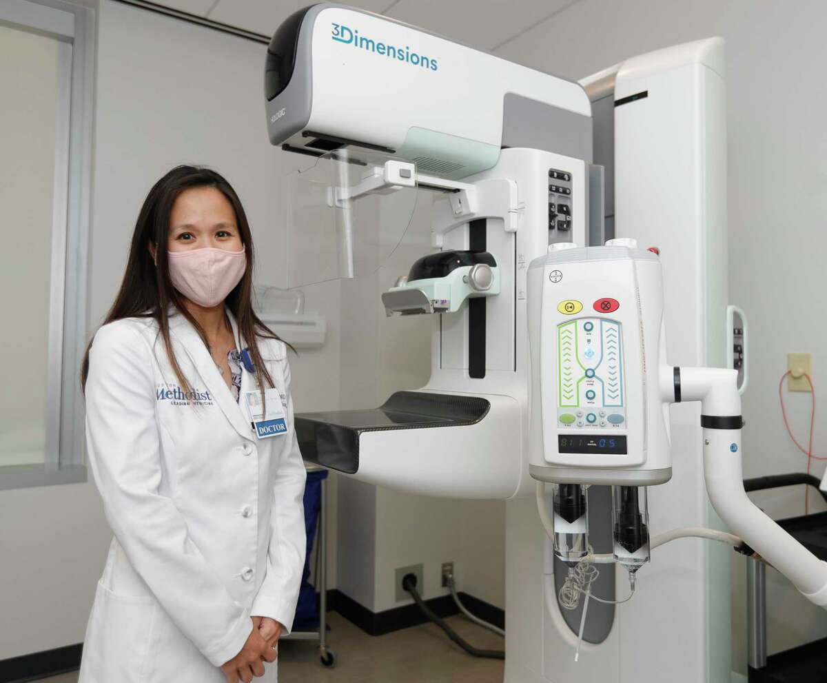 Radiologist Dr. Kelli Ha is seen beside the machine used in contrast-enhanced mammography at Houston Methodist The Woodlands Hospital, Thursday, Sept. 30, 2021, in The Woodlands. The new technology improves cancer detection, increases diagnosis confidence and is also used to monitor response to chemotherapy prior to surgery.