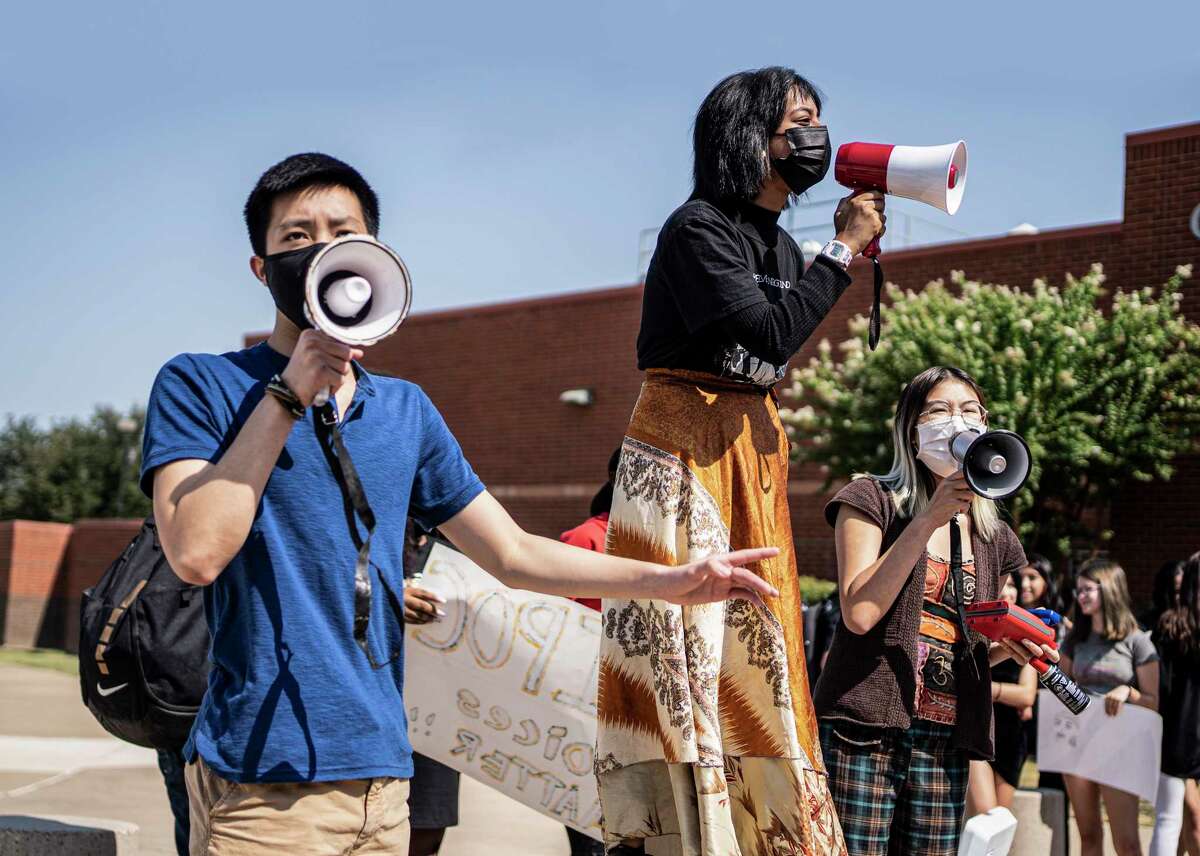 Sean Vo, 18, Sunehra Chowdhury, 17, and Grace Nguyen, 17, lead a student walk-out in early September at Colleyville Heritage High School to protest the suspension of their high school's first Black principal, James Whitfield.
