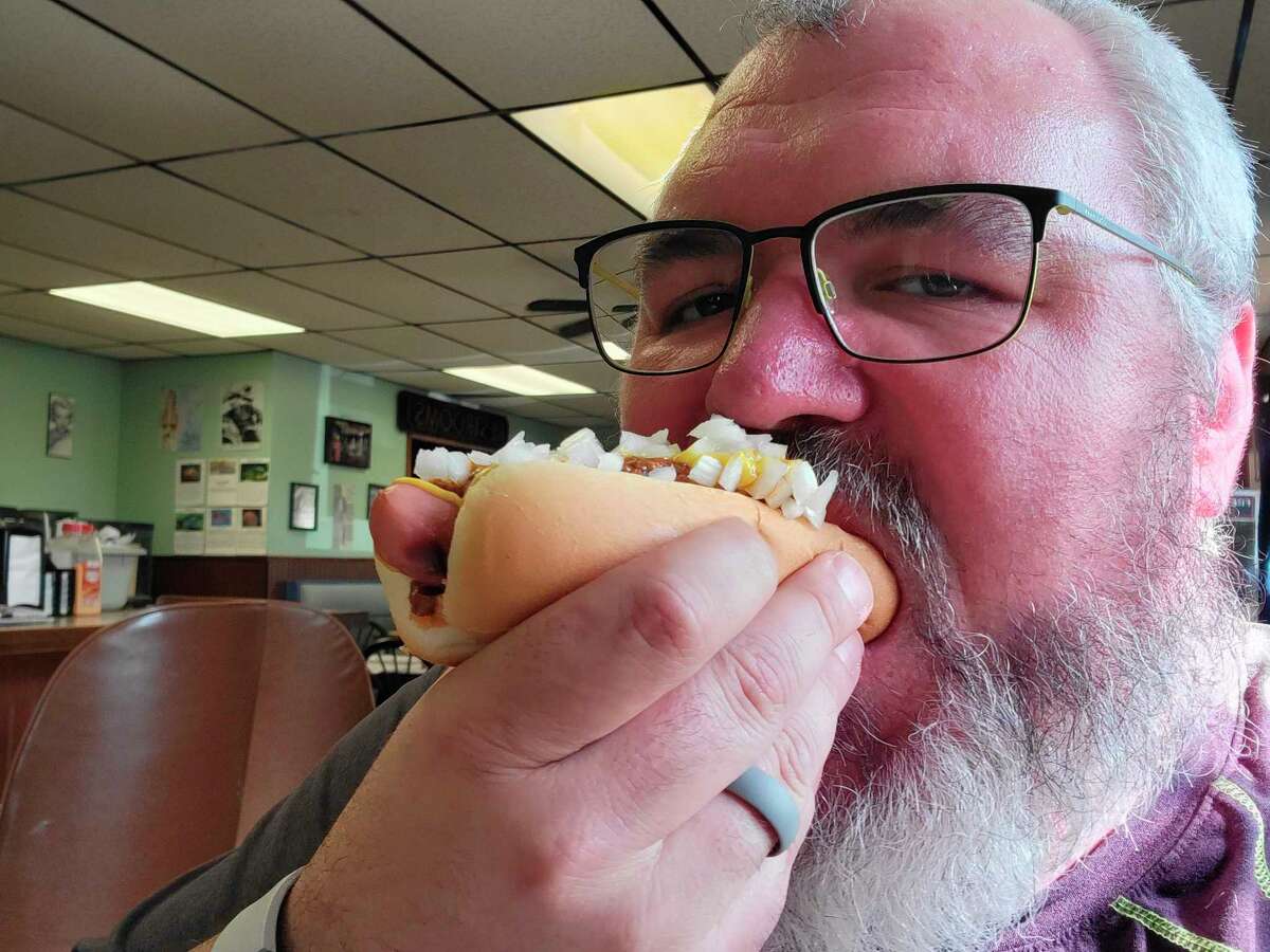 Nunn had to force himself to slow down and taste the coney. (Scott Nunn/Huron Daily Tribune)