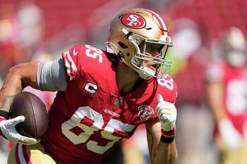 San Francisco 49ers tight end George Kittle (85) blocks Los Angeles Chargers  linebacker Amen Ogbongbemiga (57) during the first half of an NFL preseason  football game Friday, Aug. 25, 2023, in Santa