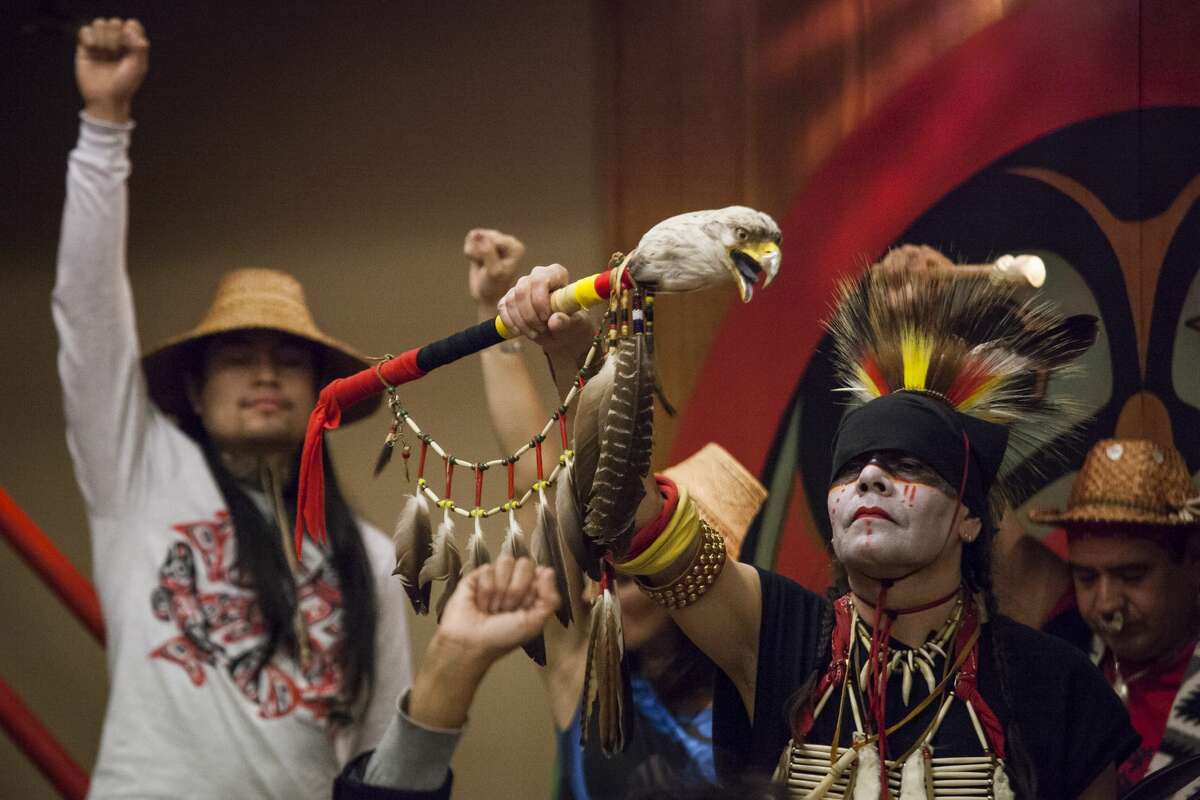 SEATTLE, WA - OCTOBER 13: Nikk "Red Weezil" Dakota (R), from the Turtle Mountain Band of Chippewa, celebrates with others from various tribes during Indigenous Peoples' Day events at the Daybreak Star Cultural Center on October 13, 2014 in Seattle, Washington. Earlier that afternoon, Seattle Mayor Ed Murray signed a resolution designating the second Monday in October to be Indigenous Peoples' Day. (Photo by David Ryder/Getty Images)