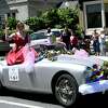 A Laurel Queen contestant rides in a decorated car, provided by her sponsor, in 2019.