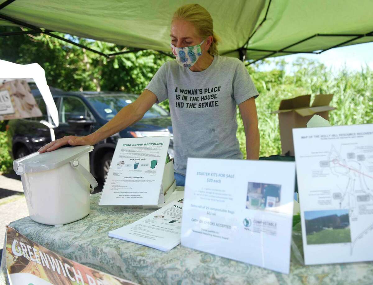 A Waste Free Greenwich booth in June 2020 at the Old Greenwich Farmers Market in Greenwich, Conn., selling home composting starter kits. Greenwich has signed on to the new Connecticut Coalition for Sustainable Materials Management, through which about half the state’s municipalities are weighing strategies to reduce waste including charging households and businesses for the amount of trash they actually produce, rather than a flat-fee for curbside pickup.