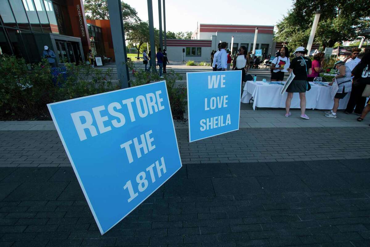 Signs supporting Rep. Sheila Jackson Lee during a rally against the redistricting efforts in Austin on Thursday, Oct. 7, 2021, at Emancipation Park in Houston, Texas.