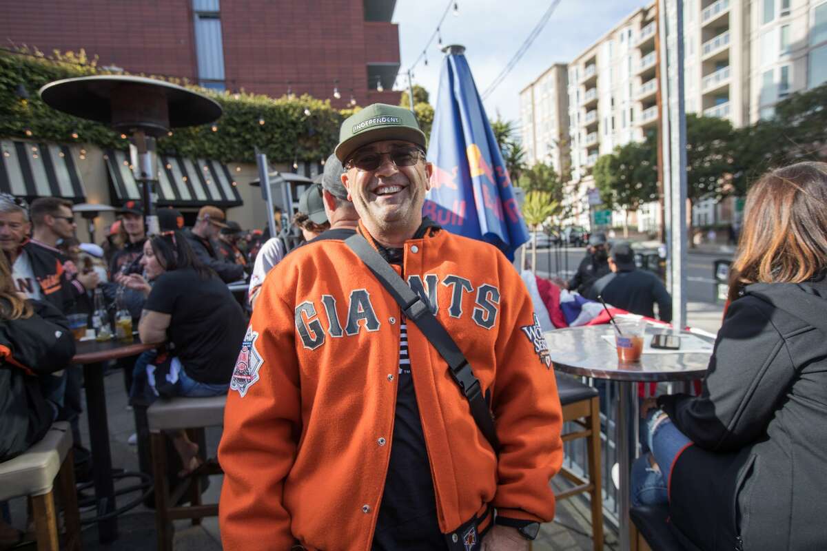 San Francisco Giants fan Rik Thomas traveled from Idaho to watch Game 1 of the National League Division Series. He grabbed a drink on the packed outdoors patio at MoMo's on Oct. 8, 2021.