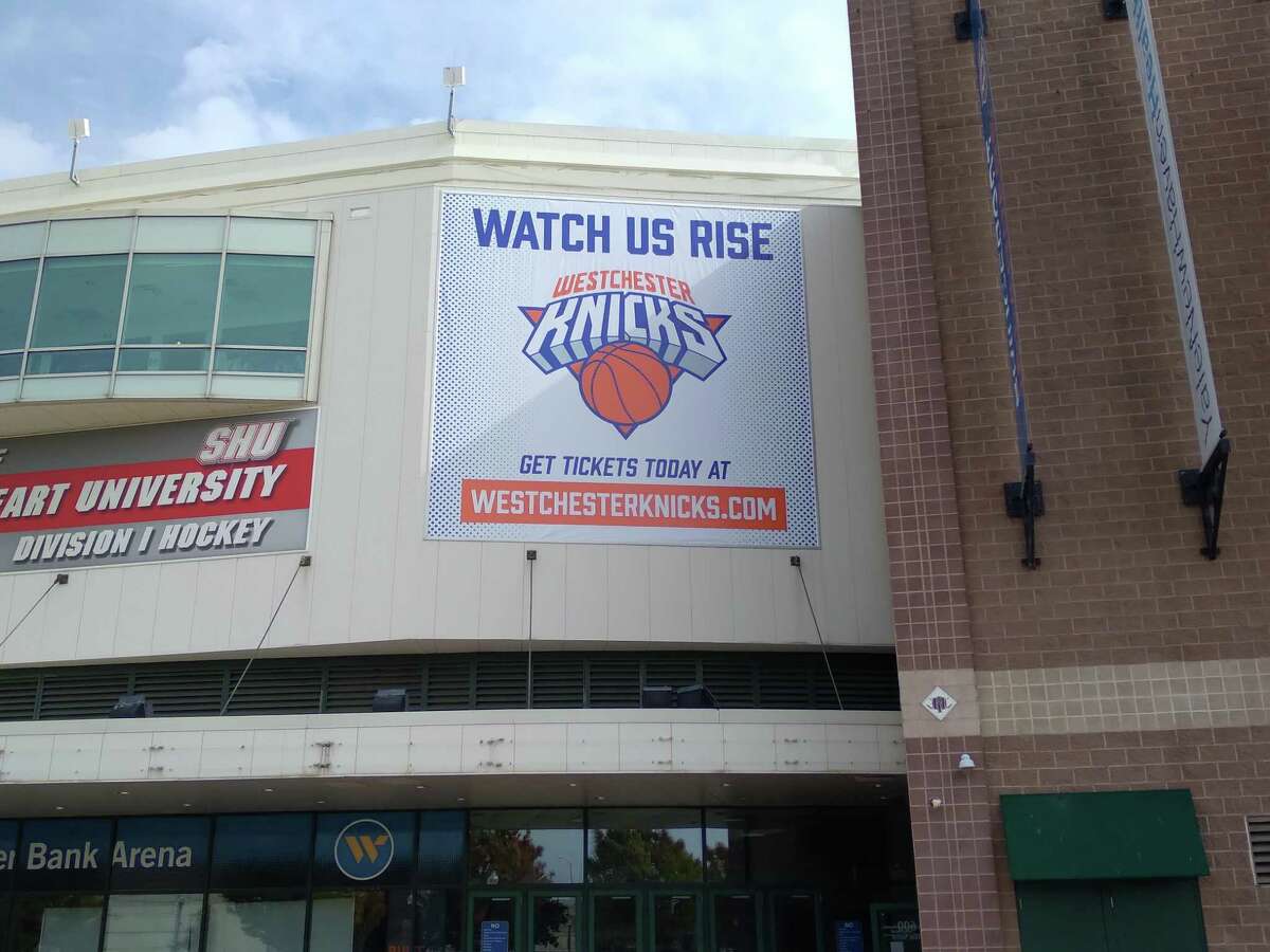 A banner outside Webster Bank Arena advertises the minor league Westchester Knicks on Saturday.