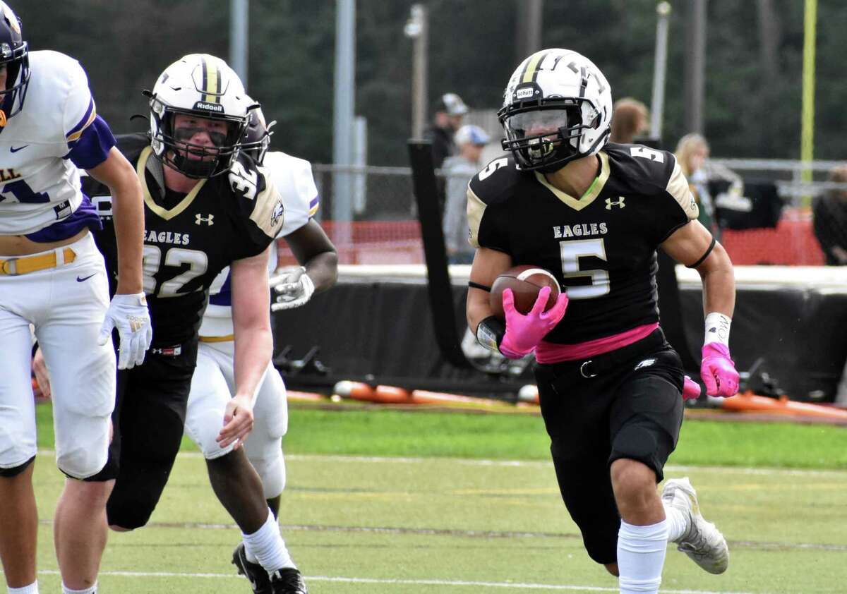 Trumbull’s Corbin Smith runs the ball against Westhill on Saturday.