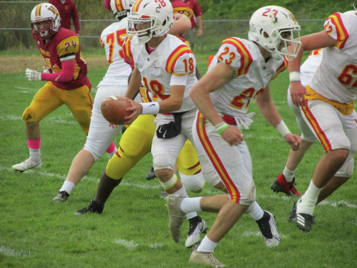 Gilbert/Northwestern/Housatonic quarterback Greyson Ursone spent much of Saturday afternoon handing off to his talented runners in a win over Windsor Locks/Suffield/East Granby at Van Why Field.