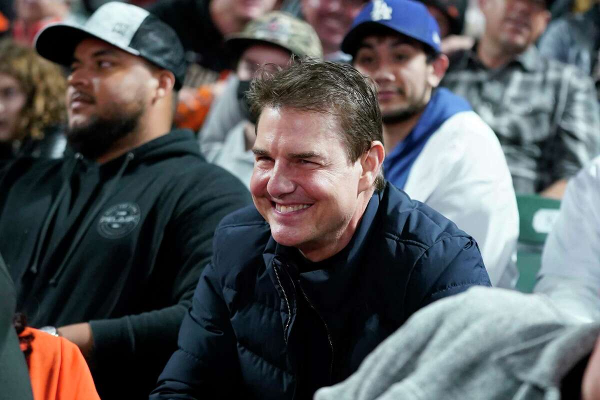 Actor Tom Cruise smiles during Game 2 of a National League Baseball Division Series between the San Francisco Giants and the Los Angeles Dodgers on Saturday, October 9, 2021 in San Francisco.  (AP Photo / Jeff Chiu)