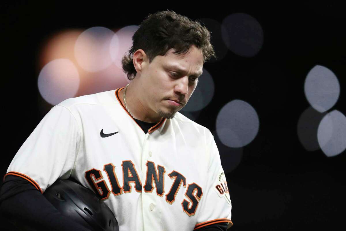 San Francisco Giants' Wilmer Flores reacts after being thrown out at third base against the Los Angeles Dodgers during the sixth inning of Game 2 of a baseball National League Division Series Saturday, Oct. 9, 2021, in San Francisco. (AP Photo/Jed Jacobsohn)