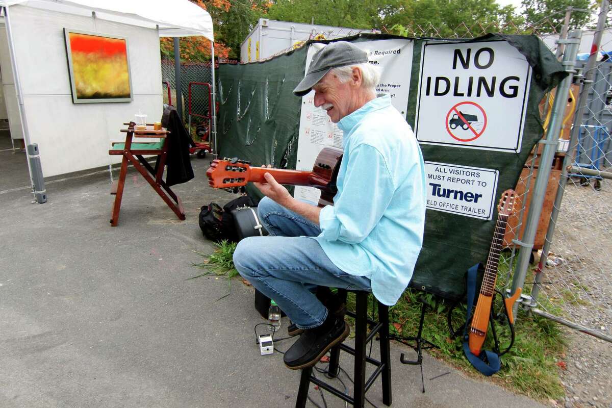 Musician Ed Wright entertains festival goers during Bruce Museum's 40th annual outdoor Art Festival held on the museum grounds in Greenwich, Conn., on Saturday October 9, 2021. The festival features original work by artists and craftspeople from around the country. All artists attend in person, and all works are for sale. The hours are 10 a.m. to 5 p.m. on Sunday. Tickets are available at BruceMuseum.org.