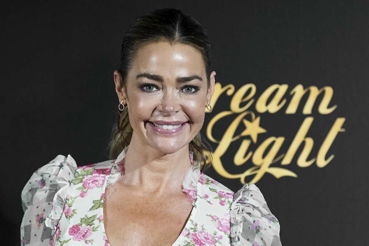 Actress Denise Richards attends "Glow & Darkness" photocall at the Palace Hotel on October 26, 2020 in Madrid, Spain. 