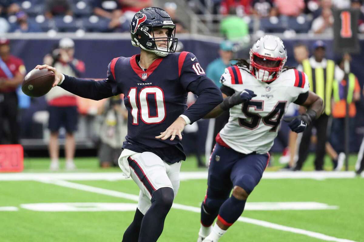 Houston Texans quarterback Davis Mills (10) rolls out to pass against the New England Patriots during the first half of an NFL football game Sunday, Oct. 10, 2021, in Houston.