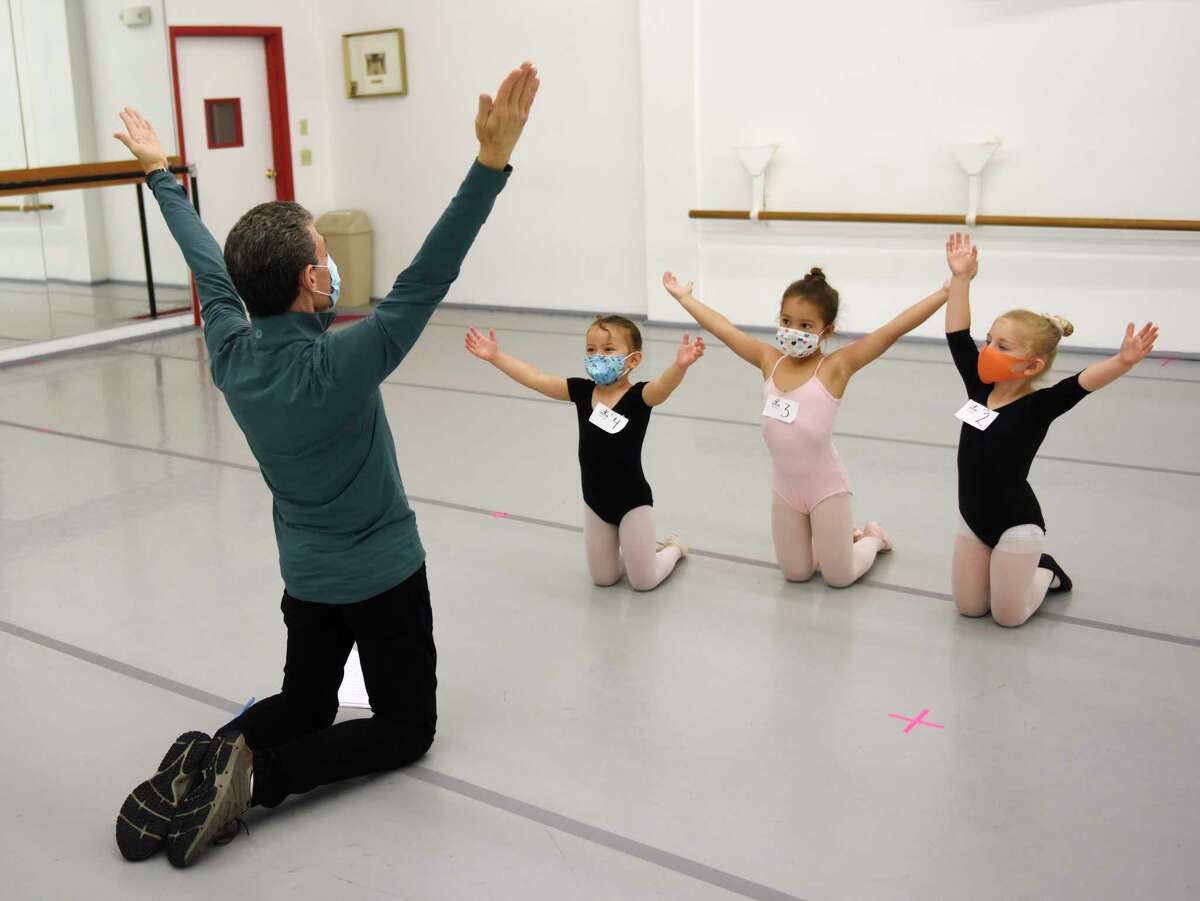 Artistic Director and Founder Brett Raphael leads four-year-olds Isla McBeth, Karina Michalczyk, and Sophie Micewicz through auditions for "The Nutcracker" at Connecticut Ballet in Stamford, Conn. Sunday, Oct. 10, 2021. After a two year hiatus due to COVID, "The Nutcracker" will return this year with performances on Dec. 18 and 19 at The Palace in Stamford.