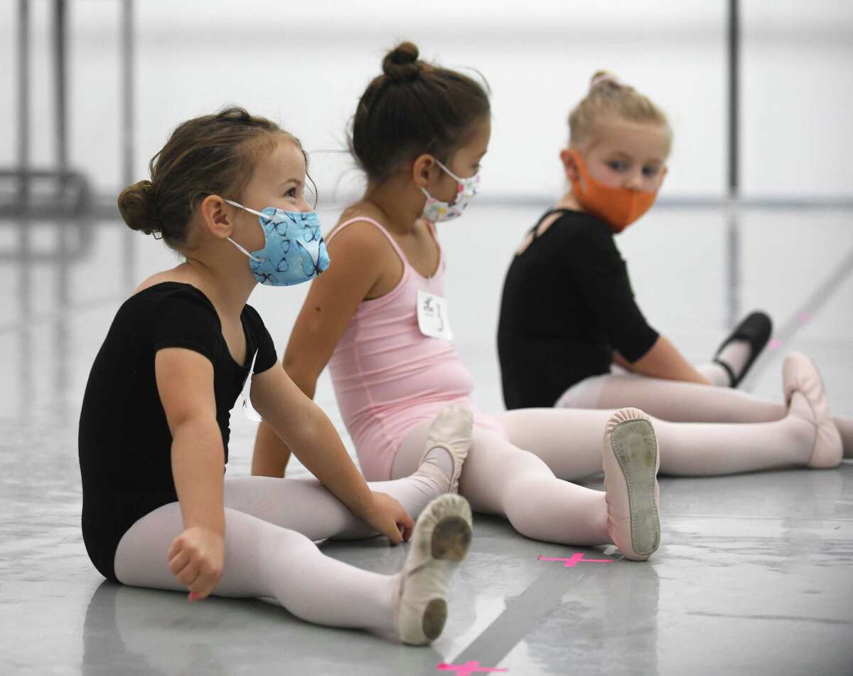 Isla McBeth, 4, stretches out during her audition for "The Nutcracker" at Connecticut Ballet in Stamford, Conn. Sunday, Oct. 10, 2021. After a two year hiatus due to COVID, "The Nutcracker" will return this year with performances on Dec. 18 and 19 at The Palace in Stamford.
