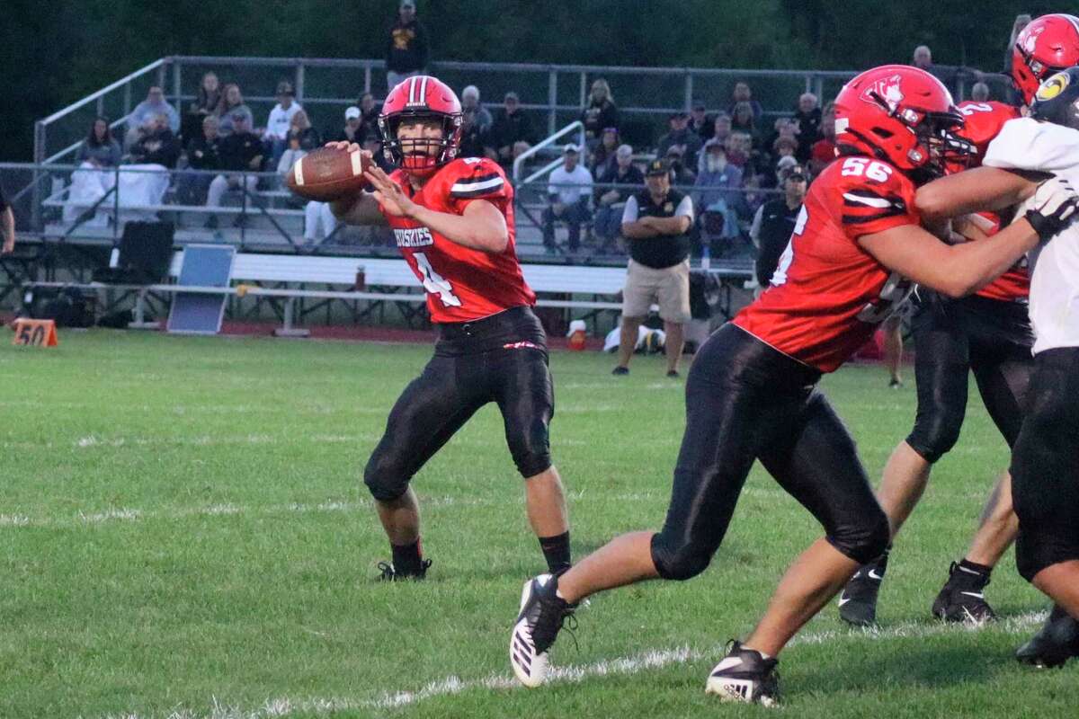 Benzie Central's Ike Koscielski drops back to pass during a game earlier this season. (File photo)