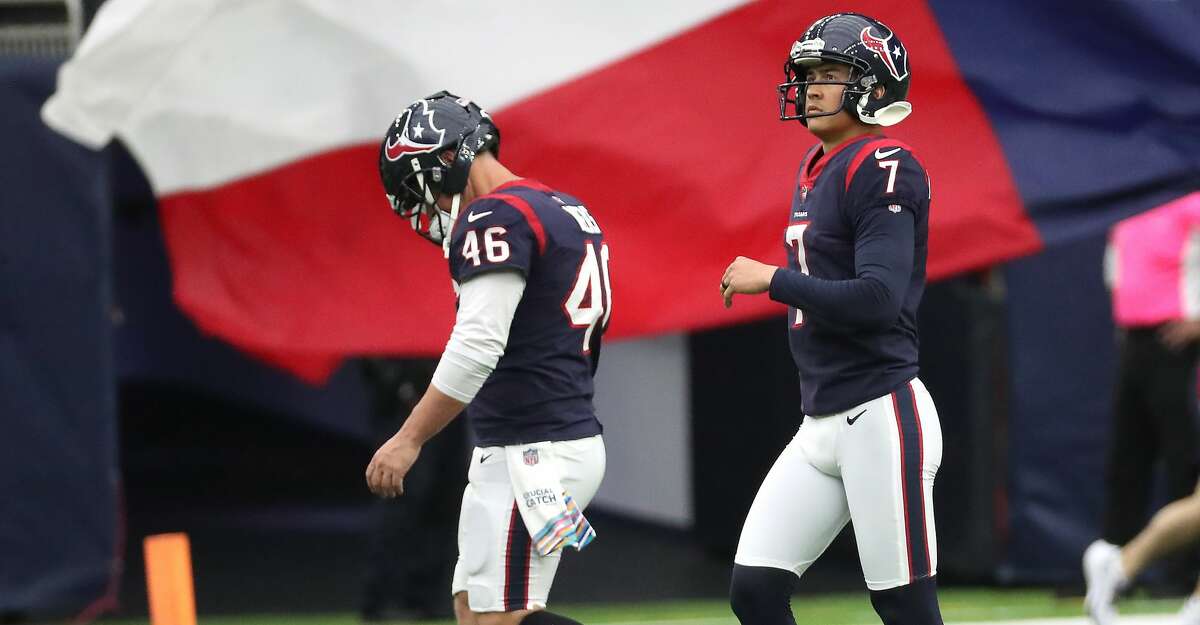 Houston Texans long snapper Jon Weeks (46) and place kicker Ka'imi Fairbairn (7) walk off the field after Fairbairn missed his second extra point attempt of the game against the New England Patriots during the first half of an NFL football game Sunday, Oct. 10, 2021, in Houston.