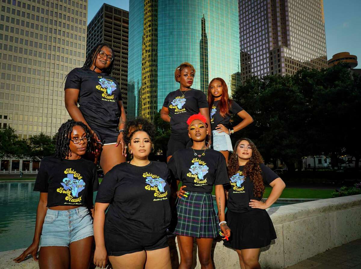 (Top row, left to right) Crystal A., Mia Williams and Donavyn Hightower, (Bottom row, left to right) Jermaya Banks, Chris Caldwell, Nia Jones and Stephany Valdez, all members of Hoochies of Houston, a grassroots organization advocating for Black women, stand outside of Houston's city hall building, Friday, Oct. 8, 2021. The group alleges that after being asked to co-organize the recent Houston Women's March, their members were disrespected during the process and actual event.