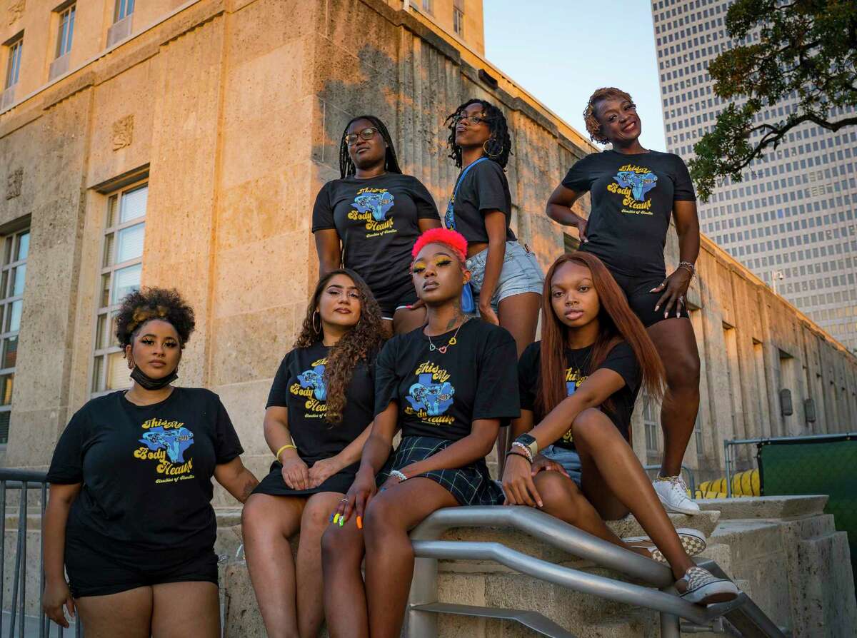(Top row, left to right) Crystal A., Jermaya Banks, Mia Williams, (Bottom row, left to right) Chris Caldwell, Stephany Valdez, Nia Jones and Donavyn Hightower, all members of Hoochies of Houston, a grassroots organization advocating for Black women, stand outside of Houston's city hall building, Friday, Oct. 8, 2021. The group alleges that after being asked to co-organize the recent Houston Women's March, their members were disrespected during the process and actual event.