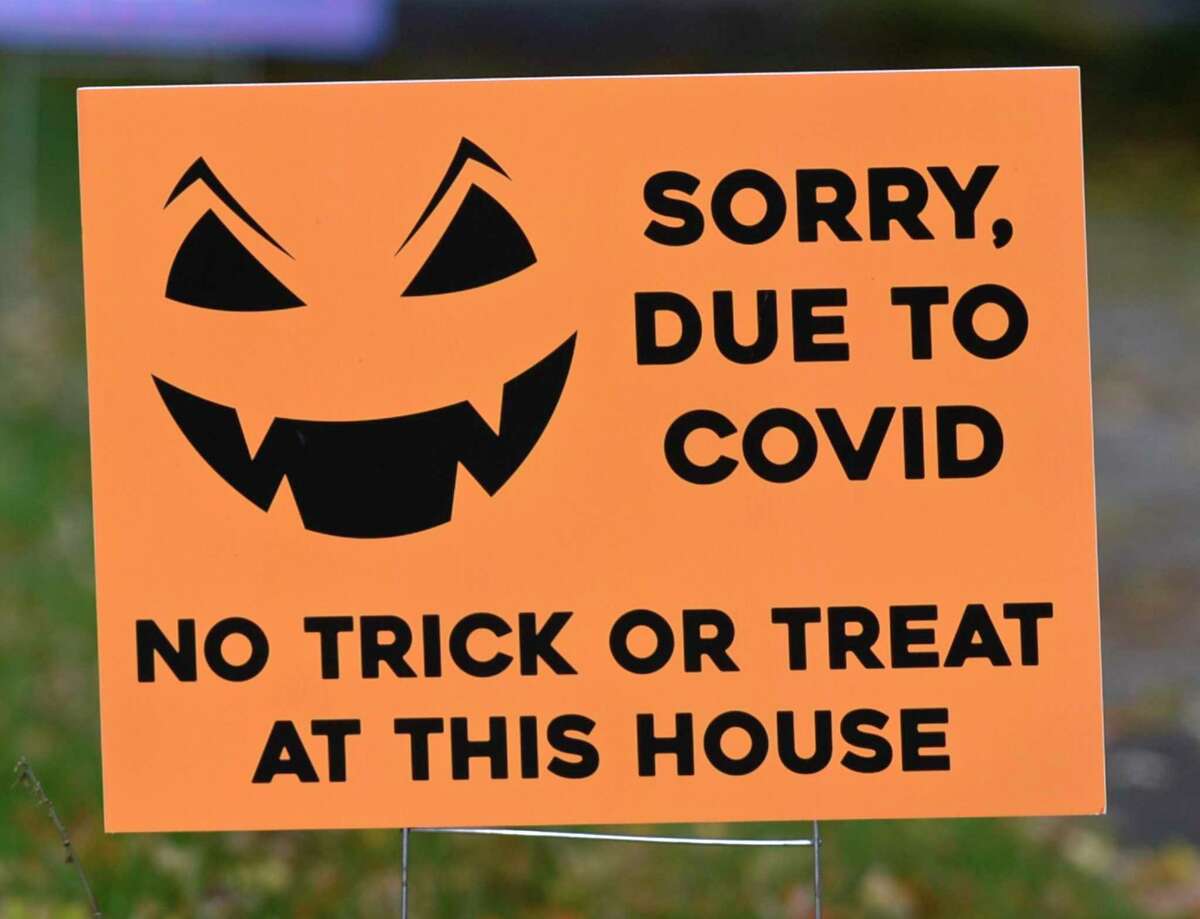 Some Danbury residents placed signs in their yards last Halloween, announcing that they would not be handing out candy due to COVID-19.