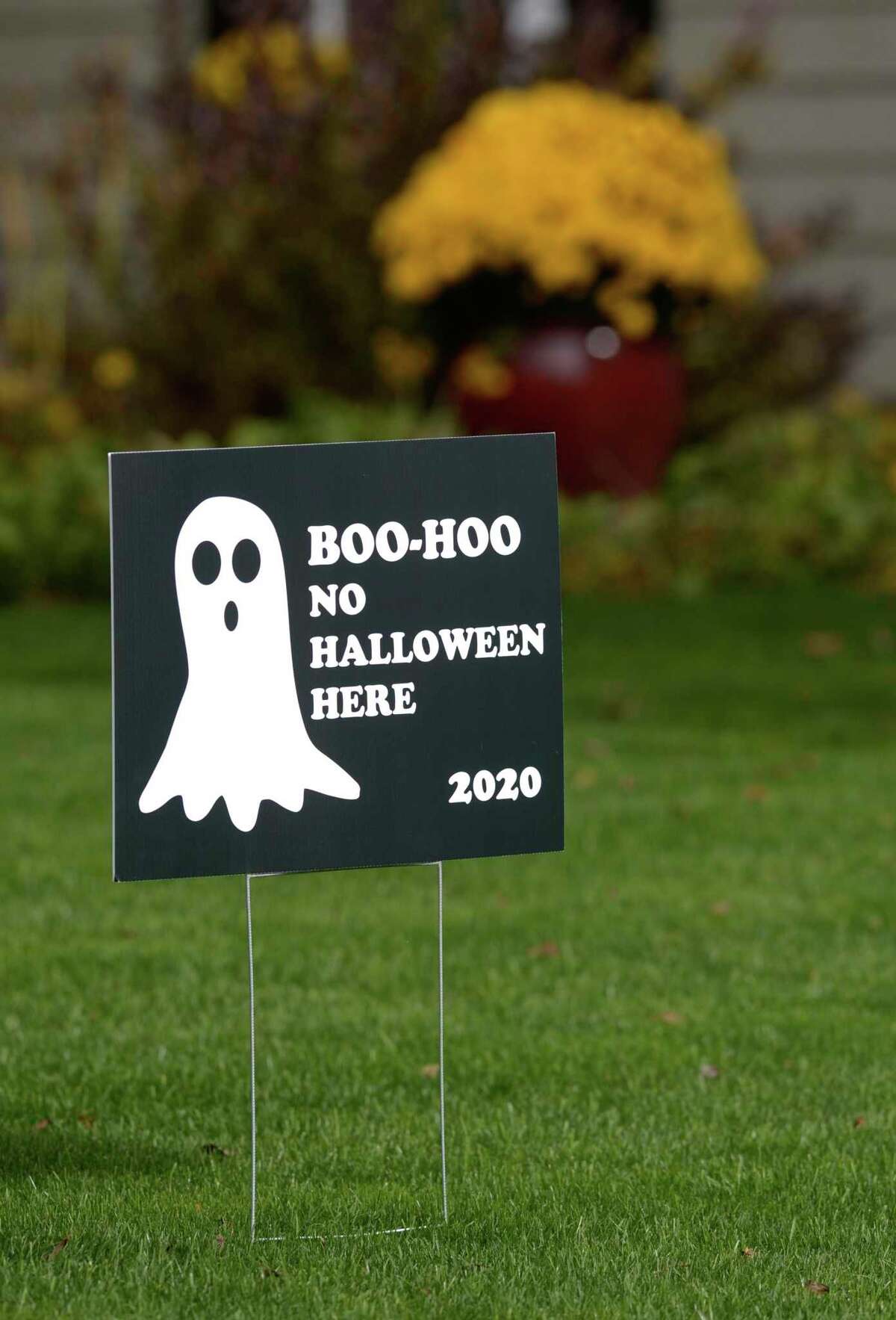 Some Danbury residents placed signs in their yards last Halloween, announcing that they would not be handing out candy due to COVID-19.