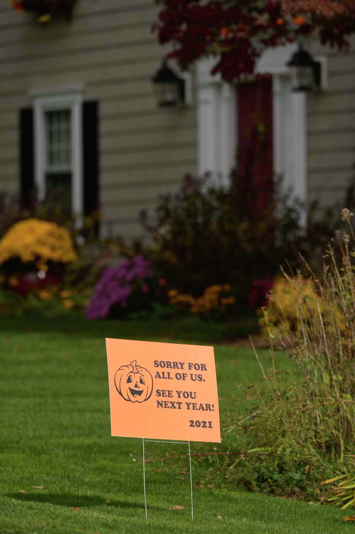 Some Danbury residents placed signs in their yards last Halloween, announcing that they would not be handing out candy due to COVID-19.