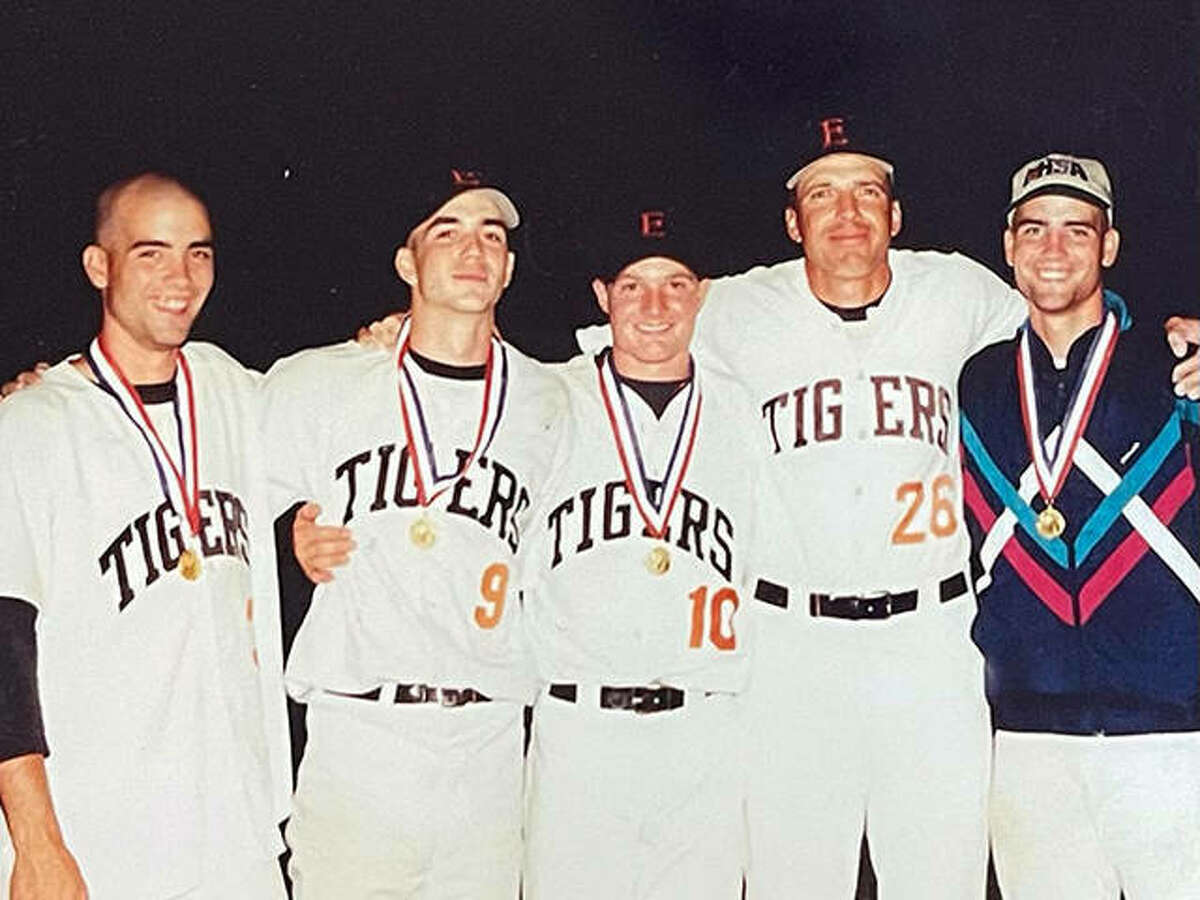 Justin Hampson, second from left, with Edwardsville pitchers Ben Hutton, left, Brad Grotefendt, middle, EHS pitching coach Mike Waldo, second from right, and pitcher James Hutton, after the Tigers won the Class AA state championship in 1998.