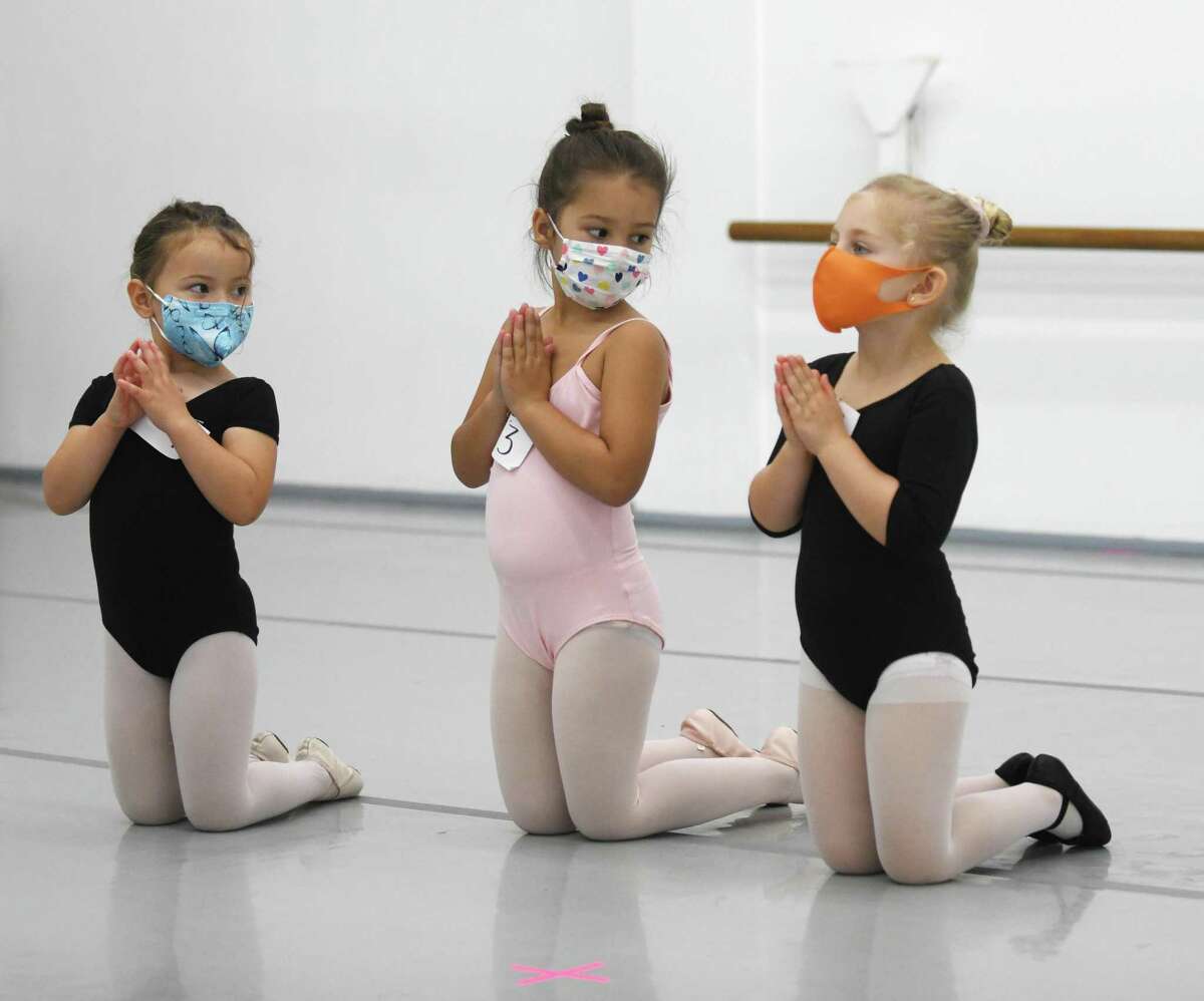 Four-year-olds Isla McBeth, left, Karina Michalczyk, center, and Sophie Micewicz audition for "The Nutcracker" at Connecticut Ballet in Stamford, Conn. Sunday, Oct. 10, 2021. After a two year hiatus due to COVID, "The Nutcracker" will return this year with performances on Dec. 18 and 19 at The Palace in Stamford.