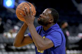 Golden State Warriors forward Draymond Green (23) warms up for a preseason NBA basketball game against the Los Angeles Lakers in San Francisco, Friday, Oct. 8, 2021. (AP Photo/Scot Tucker)