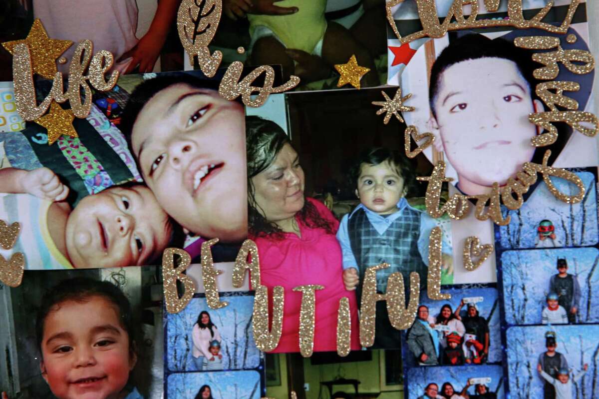 Photos of Maria Castañeda’s children are arranged in a collage on the wall inside her tiny home at Casitas de Esperanza in San Jose.