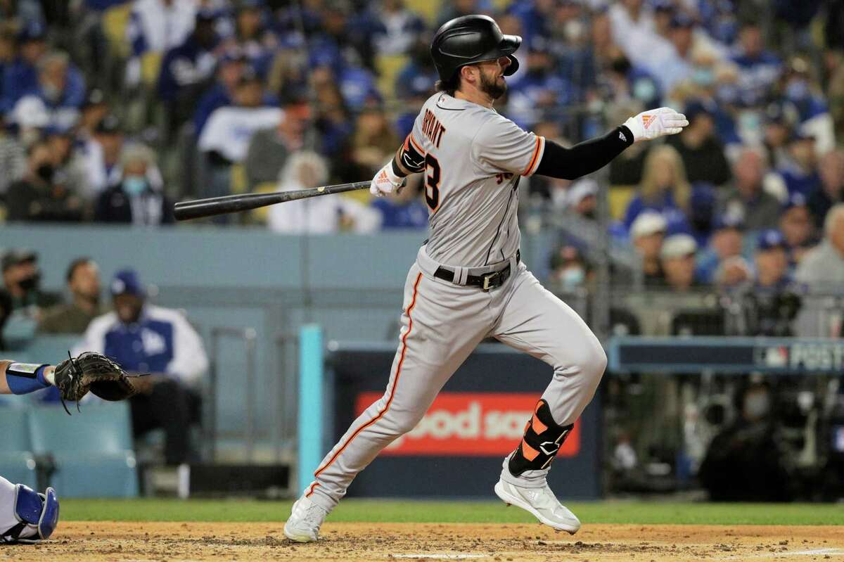 San Francisco Giants Kris Bryant (23) hits a line drive single during the fourth inning as the San Francisco Giants played the Los Angeles Dodgers in Game 3 of the National League Division Series at Dodger Stadium in Los Angeles, Calif. on Monday, Oct. 11, 2021.