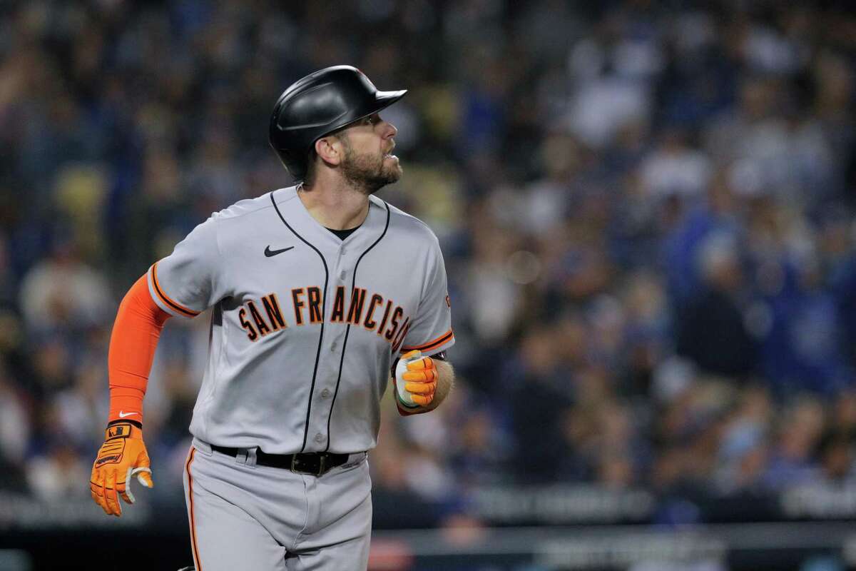 San Francisco Giants Evan Longoria (10) watches the flight of his solo home run during the top of the fifth inning as the San Francisco Giants played the Los Angeles Dodgers in Game 3 of the National League Division Series at Dodger Stadium in Los Angeles, Calif. on Monday, Oct. 11, 2021.