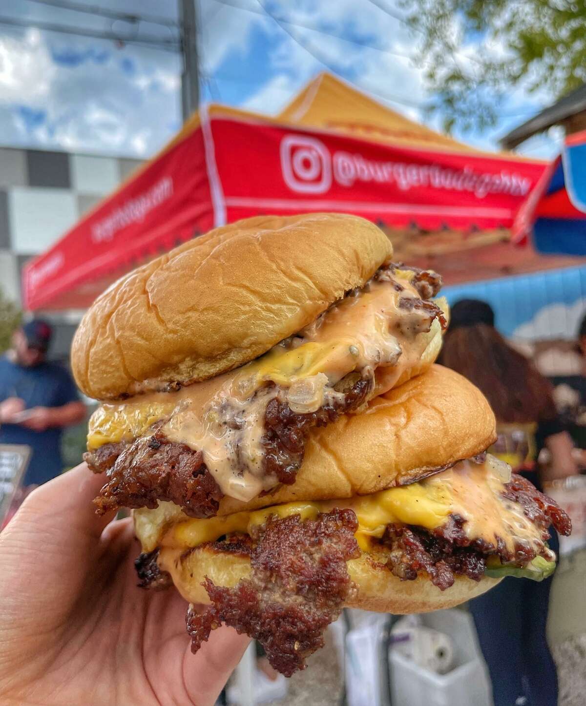 Burger Bodega is a new smash burger pop-up concept from Abbas Dhanani specializing in a double-patty burger with American cheese, grilled onions, pickles and bodega sauce.