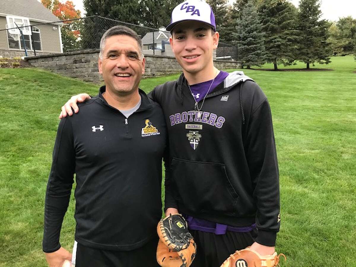 Gary Cohen with his son, Bennett, a CBA senior, who overcame brain tumor surgery and has committed to play baseball at The College of Saint Rose, where his father played baseball and his sister, Colette, plays softball. (Paul Grondahl / Times Union)