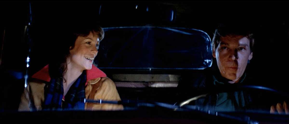 Elizabeth (Jamie Lee Curtis) is picked up by Nick Castle (Tom Atkins) and they drive down Bear Valley Road in Olema.