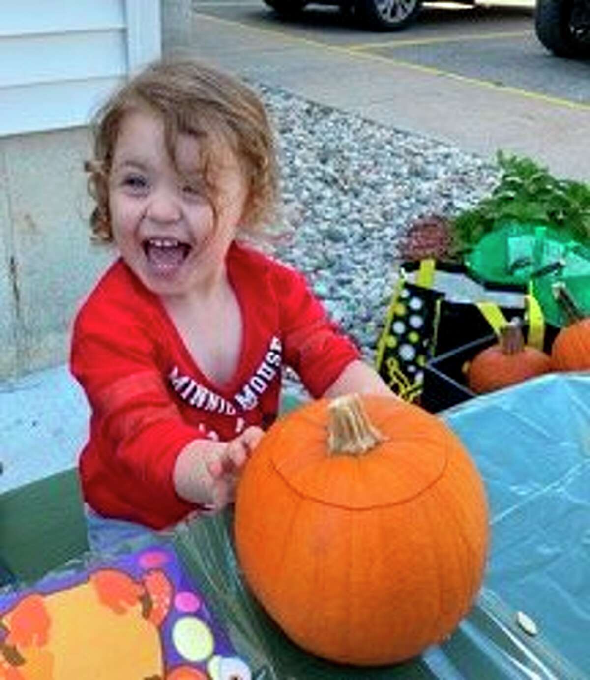Abigail Donlin appears to be more than excited during a recent Spirit of the Woods Garden Club-Manistee County Library October Pumpkin Fest Program event. (Courtesy photo)