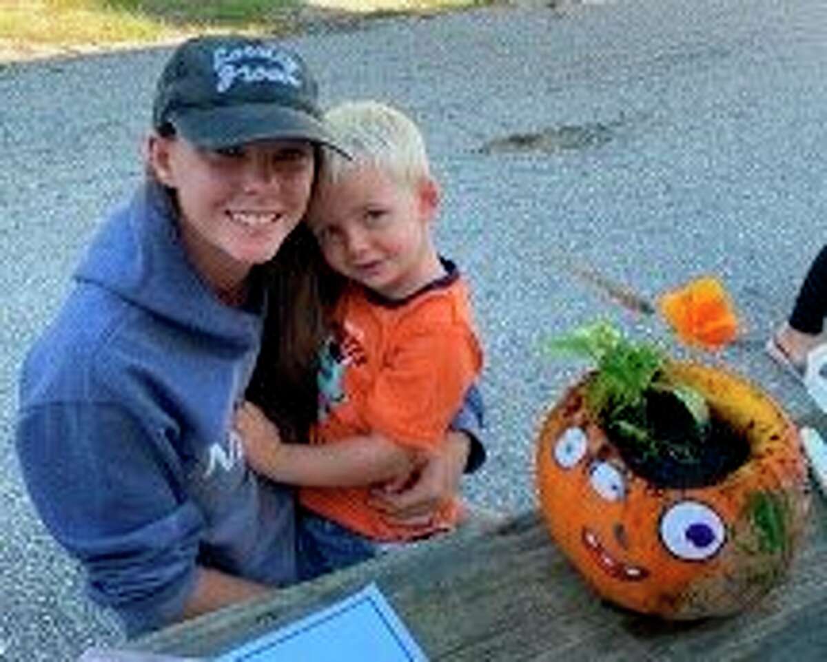Briana Maison and Elon Maison are all smiles after a recent event where young participants decorate with flowers planted in pumpkins. The first events were held in Wellston on Oct. 5 and was followed by events in Manistee on Oct. 9 and in Kaleva on Oct. 12. (Courtesy photo)